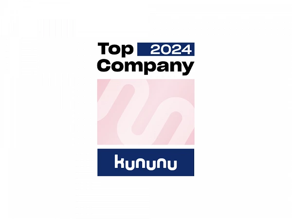 Das Bild zeigt das Logo einer Auszeichnung mit dem Text "Top Company 2024" in schwarzer und blauer Schrift. Darunter ist das Wort "kununu" in blauer Schrift auf einem weißen Hintergrund abgebildet, umgeben von einem rosa farbigen Feld mit einem grafischen Muster.